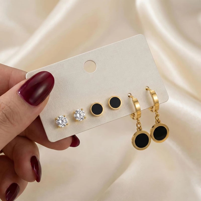 A set of three pairs of exquisite gold earrings: sparkling zircon studs, striking black posts, and luxurious black dangling circles. Crafted from durable stainless steel, a captivating and perfectly harmonious combination. - Image 4